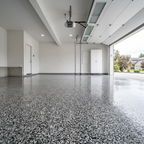 Glossy epoxy flake floor in a modern garage